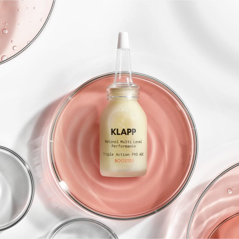 KLAPP RESIST AGING Retinol Triple Action PRO AGE Booster – Anti-Aging-Booster für die Nacht, 15ml, Spender liegend in Glasschale