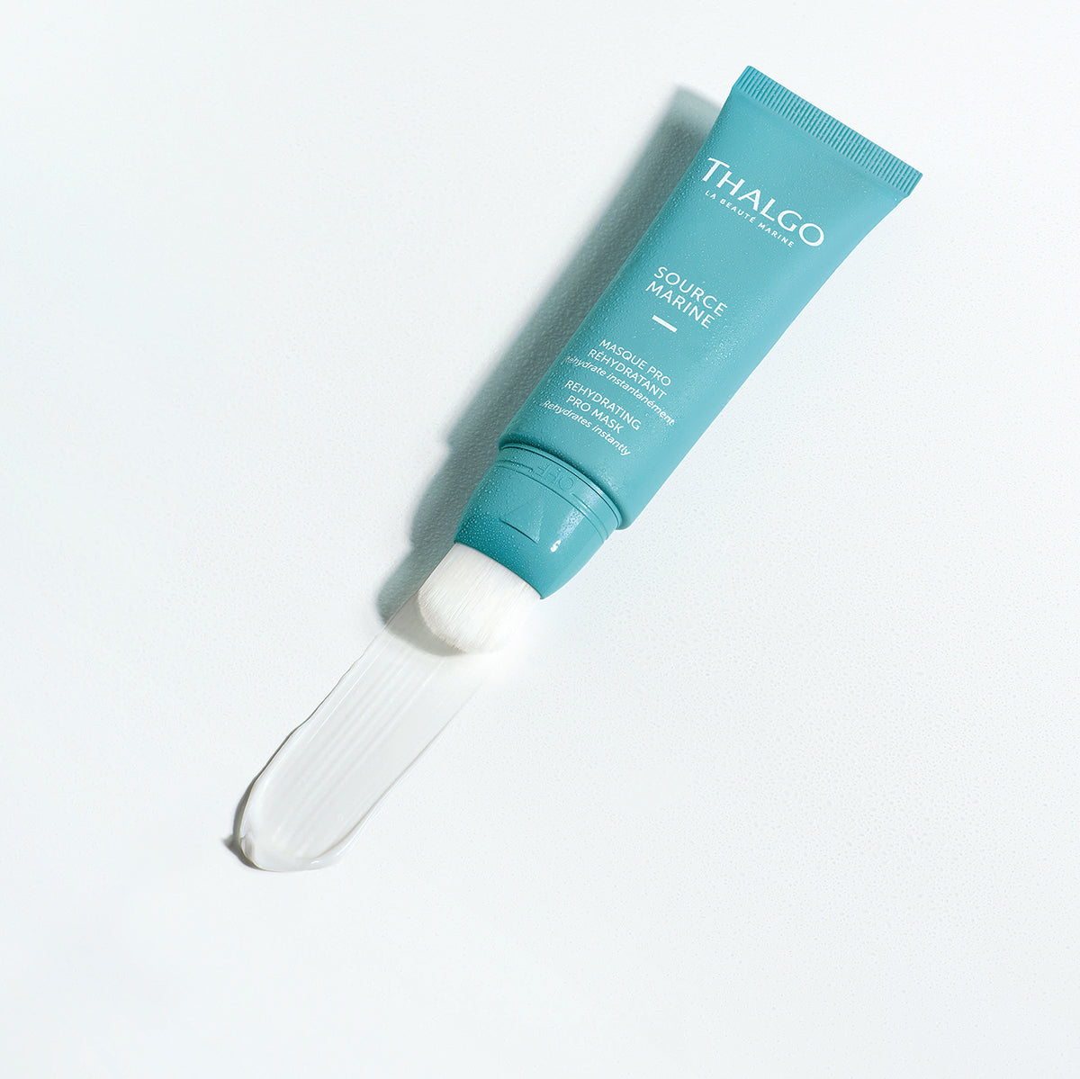 THALGO Source Marine - Masque Pro Réhydratant - Feuchtigkeitsspendende Maske – für feuchtigkeitsarme Haut, 50ml, Tube liegend offen mit Creme
