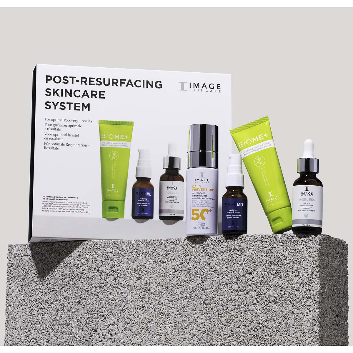 IMAGE SKINCARE Post-Resurfacing Skincare System – Pflege-Routine, 1stk, Produkte und Umkarton auf Stein